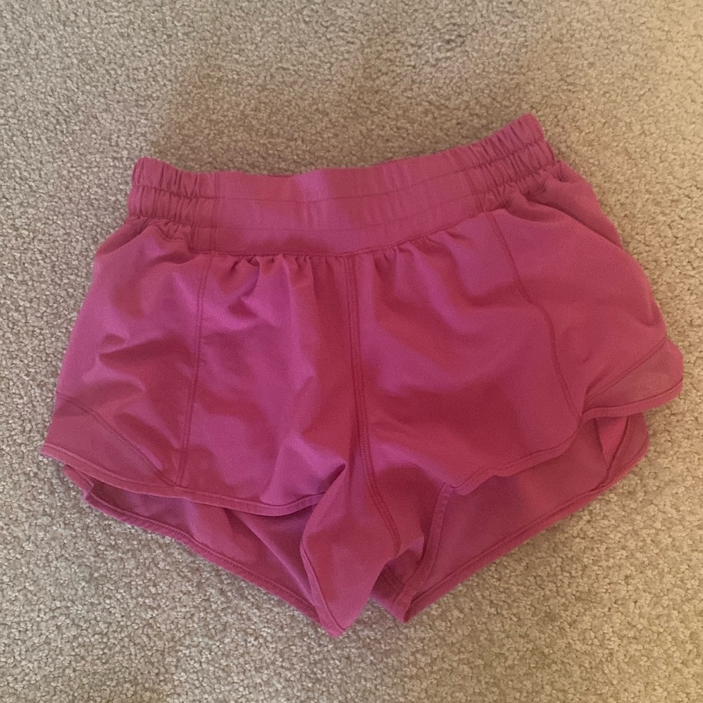 Sonic pink color lululemon Hotty hots size 4 and 2.5 inch low rise.